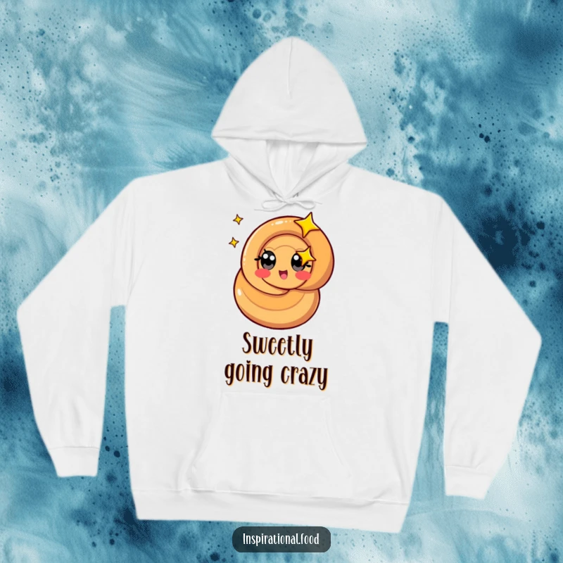 Funny caramel swirl hoodie featuring a stylized character with starry eyes spinning, offering cozy sweetness.
