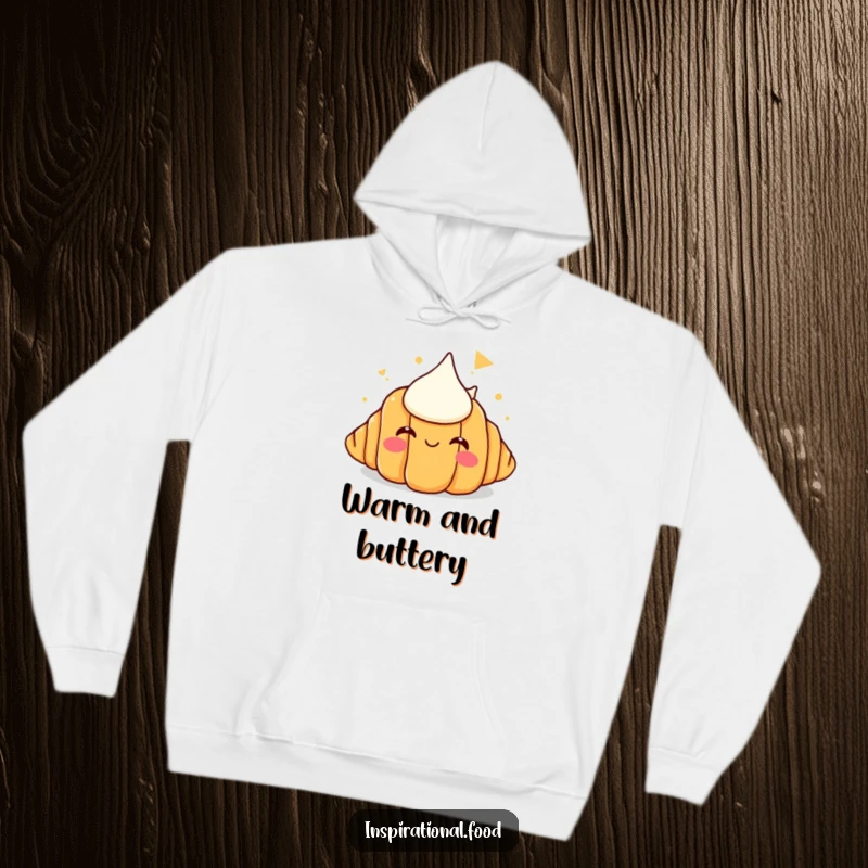 Funny hoodie print of a happy croissant with a dreamy look, imagining a huge pile of butter, perfect for a cozy laugh.
