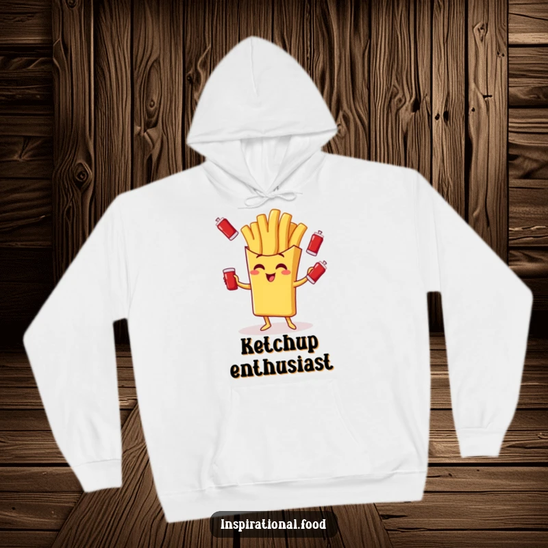 Funny hoodie with a giggling french fry character juggling ketchup packets, offering cozy and hilarious food vibes.