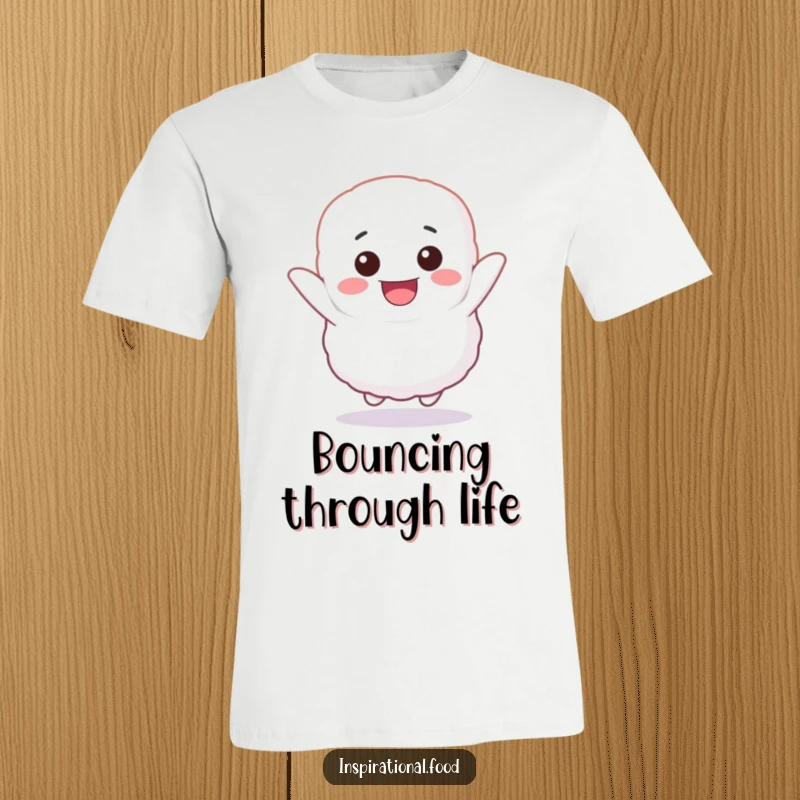 Funny T-shirt with a fluffy marshmallow character bouncing high with infectious, unbridled glee and a wide, happy smile.